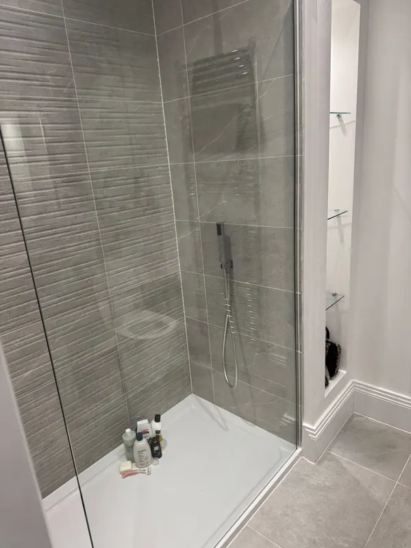 Grey-tile walk-in shower cleaned by True Grit Cleaning Co in Richmond